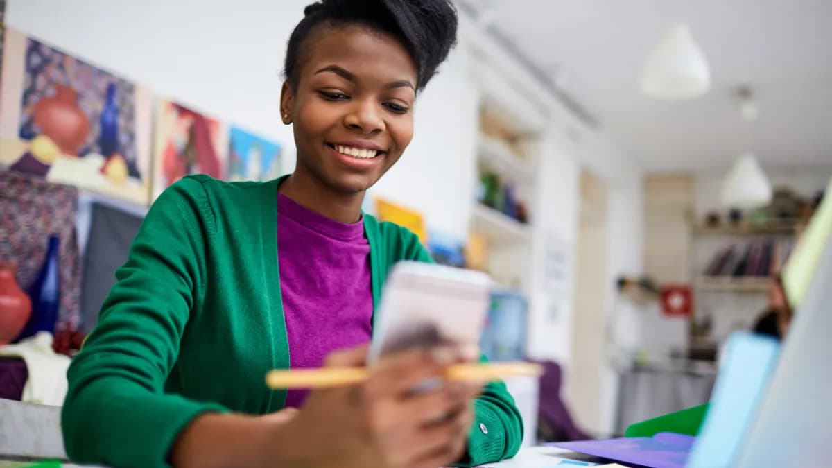 a teacher looking at her account balance on the phone.